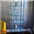 F07. Fiam Palladio curio cabinet. 66"h x 27"w x 13"d 